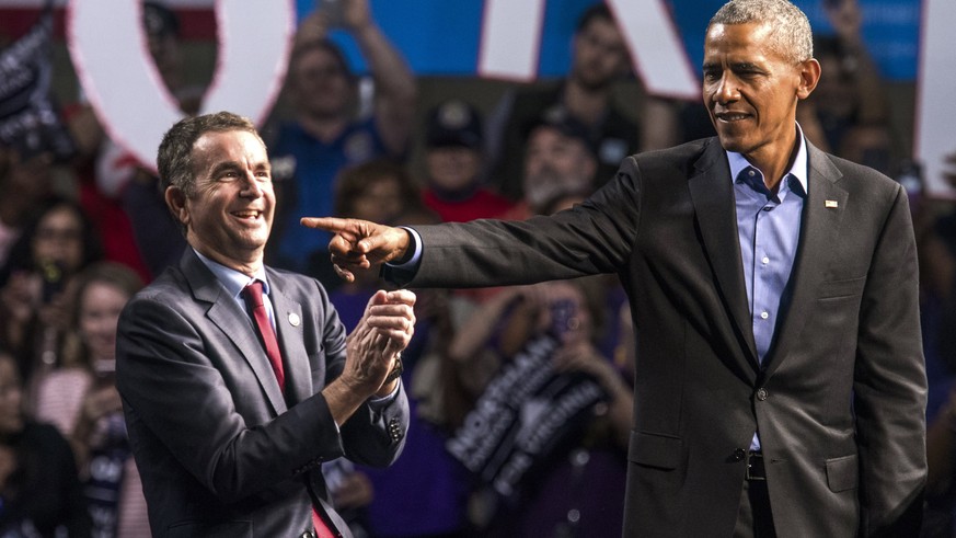 epa06277422 Former US President Barack Obama (R) campaigns with Virginia Democratic gubernatorial candidate Lt. Governor Ralph Northam (L) at the Richmond Convention Center in Richmond, Virginia, USA, ...