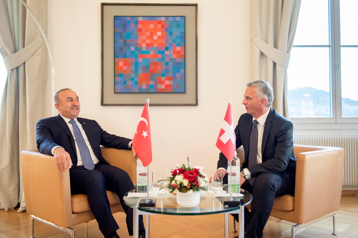 Turkey's Foreign Minister Mevlut Cavusoglu (L) and Switzerland's Federal Councillor Didier Burkhalter talk during Cavusoglu's visit to Switzerland follwing a weeks-long dispute between  ...