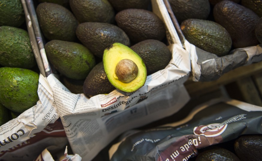 Avocados are displayed for sale in a large market in Mexico City, Tuesday, Aug. 9, 2016. Avocado trees flourish at about the same altitude and climate as the pine and fir forests of Michoacan, the sta ...