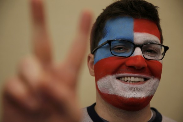 Michael Skocky of Cambridge, Massachusetts, a supporter of Republican U.S. presidential candidate Marco Rubio, poses as he waits for Rubio to arrive for his 2016 New Hampshire presidential primary nig ...