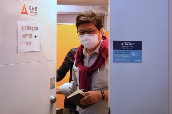 Chris Yeung, founder and chief writer of Citizen News walks out from his office before a press conference in Hong Kong Monday, Jan. 3, 2021. The Hong Kong online news site said Sunday that it would ce ...