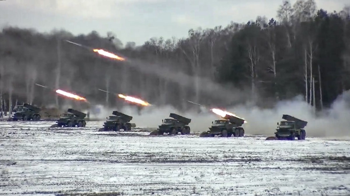 FILE - In this photo taken from video and released by the Russian Defense Ministry Press Service on Friday, Feb. 4, 2022, multiple rocket launchers fire during Belarusian and Russian joint military dr ...