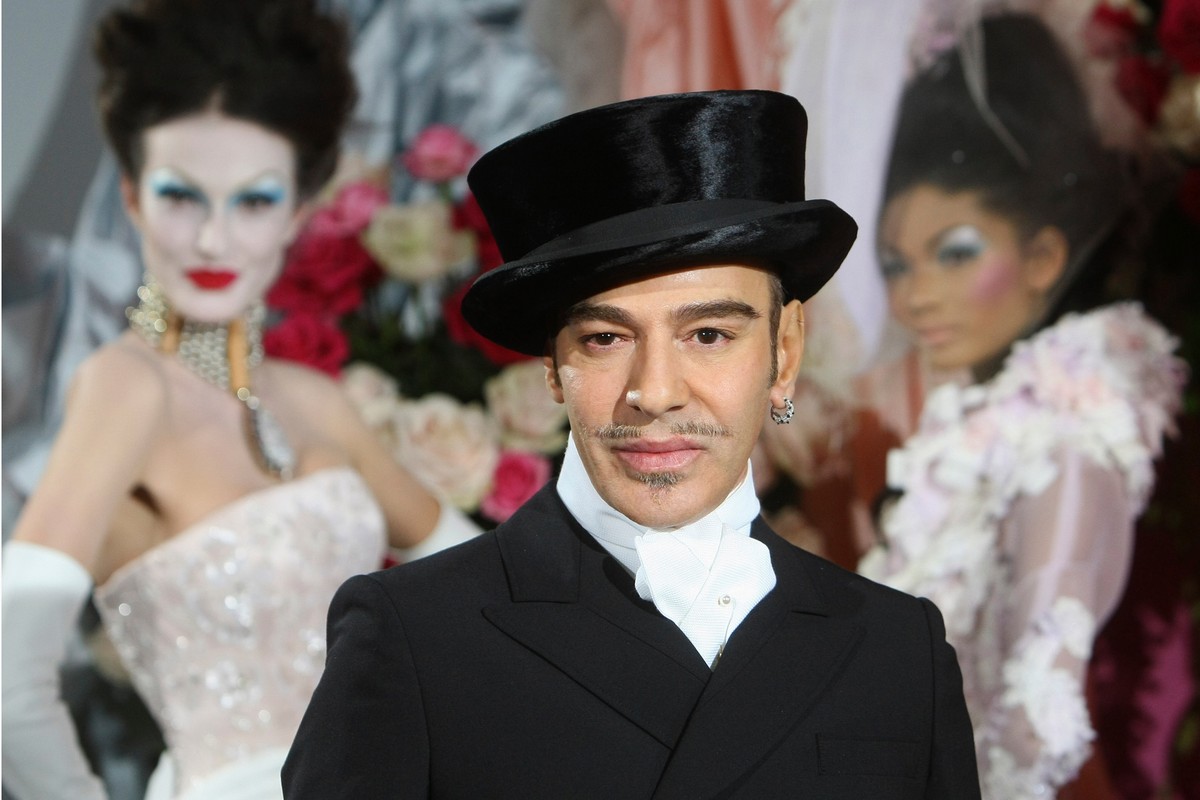 FILE - Fashion designer John Galliano poses at the end of the presentation of the Dior Haute Couture spring/summer 2010 fashion collection on Jan. 25, 2010, in Paris. (AP Photo/Jacques Brinon, File)
J ...