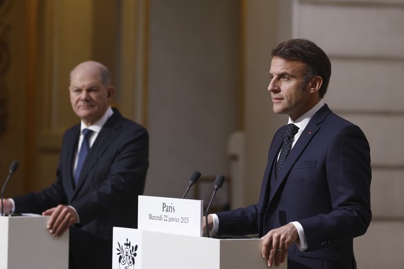 French President Emmanuel Macron, right, and German Chancellor Olaf Scholz give a joint statement at the Elysee Palace in Paris, Wednesday, Jan. 22 2025. (Mohammed Badra, Pool via AP)
German Chancello ...