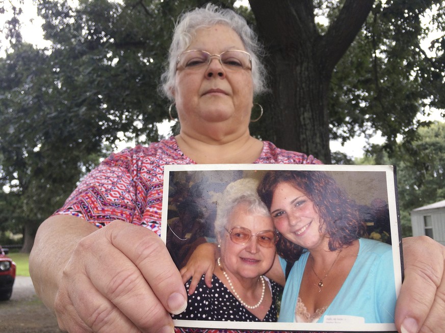 Susan Bro, the mother of Heather Heyer, holds a photo of Bro&#039;s mother and her daughter, Monday, Aug. 14, 2017, in Charlottesville, Va. Heyer was killed Saturday, Aug. 12, 2017, when police say a  ...