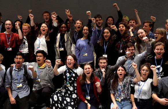 epa08043603 Members from the global movement of youngsters against climate change pose for a photograph during an event held within the UN Climate Change Conference COP25 in Madrid, Spain, 04 December ...