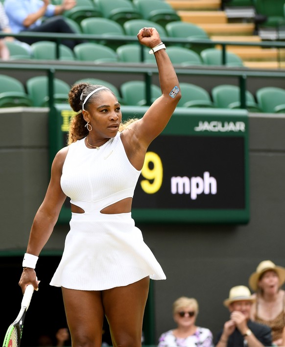 epa07703292 Serena Williams of the USA in action against Carla Suarez Navarro of Spain during their fourth round match for the Wimbledon Championships at the All England Lawn Tennis Club, in London, B ...