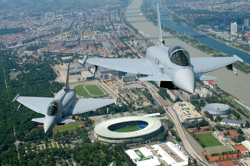 epa06073159 (FILE) A handout file photo made available by Austrian Ministry of Defence showing two Eurofighter fighter planes flying past the Ernst-Happel-Stadium in Vienna, one of the EURO 2008 socce ...