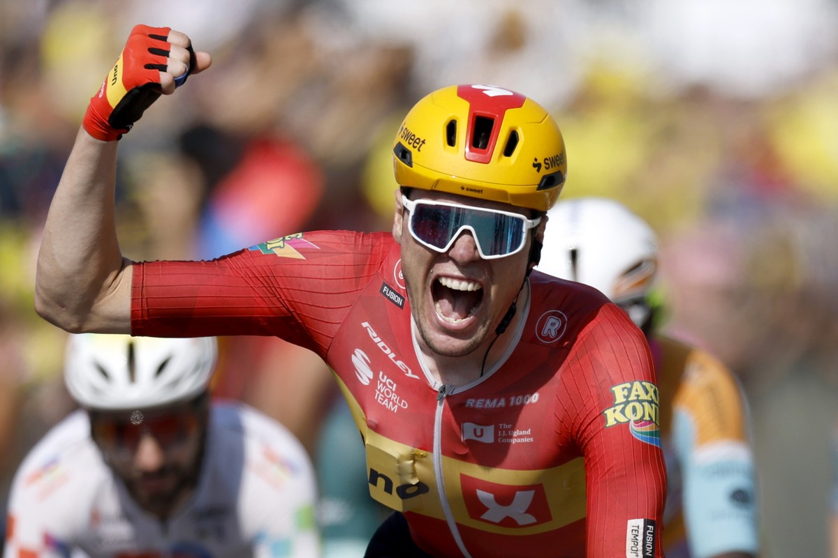 epa13113065 Norwegian cyclist Soren Waerenskjold of Uno-X Mobility celebrates as he crosses the finish line to win Stage 11 of the Tour de France, a 161.3 km route from Vichy to Nevers, France, 15 Jul ...