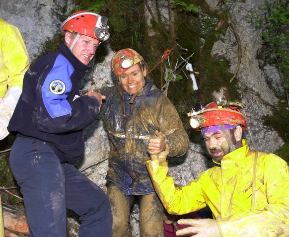 One of the eight Swiss students, center, who were trapped in the cave &#039;Bief Paroux&#039; in Goumois, France, smiles as she comes out of the cave Saturday evening, May 19, 2001. Rescuers delayed a ...