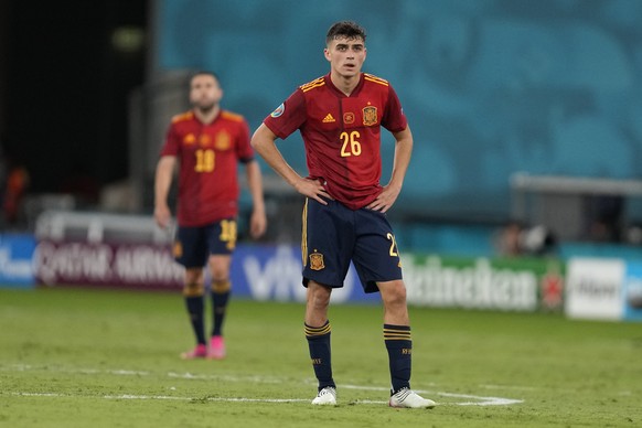 Spain&#039;s Pedri, center, reacts after the Euro 2020 soccer championship group E match between Spain and Poland at La Cartuja stadium in Seville, Spain, Saturday, June 19, 2021. (AP Photo/Thanassis  ...