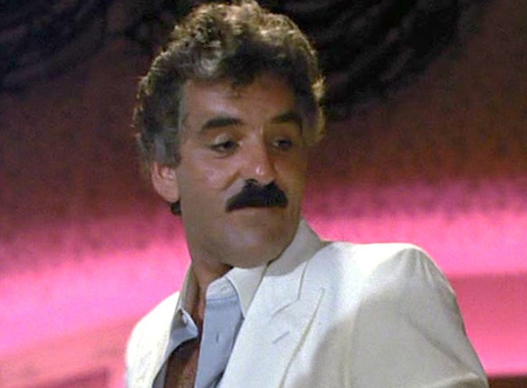 Dennis Farina in Miami Vice 
https://www.eonline.com/news/441294/r-i-p-dennis-farina-his-most-memorable-tv-roles