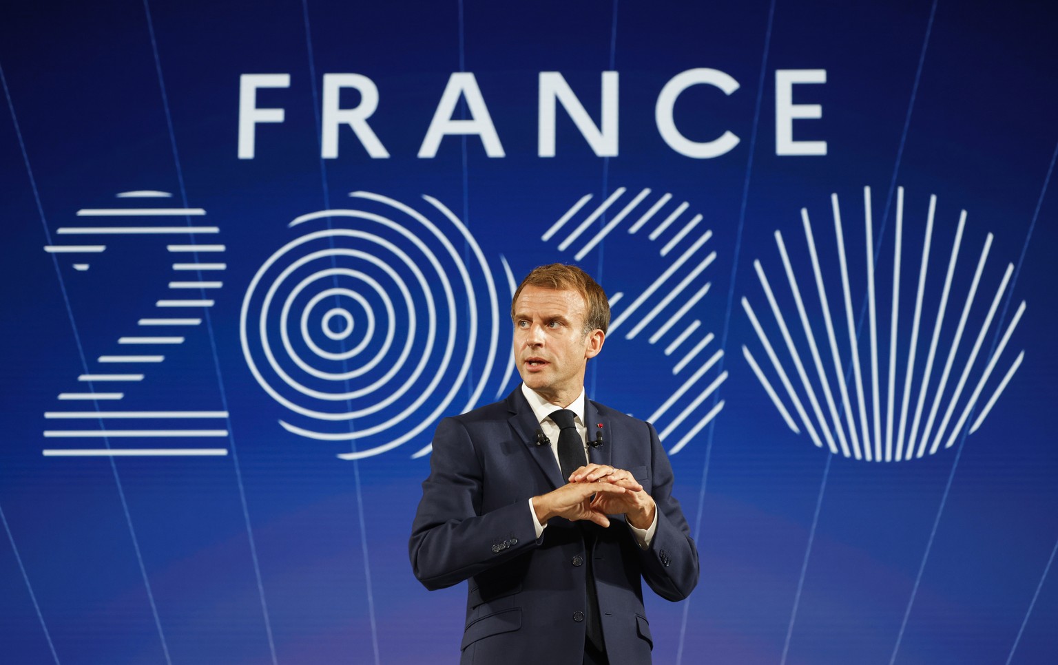 epa09519641 France&#039;s President Emmanuel Macron gestures as he speaks during the presentation of &quot;France 2030&quot; investment plan at The Elysee Presidential Palace in Paris, France, 12 Octo ...