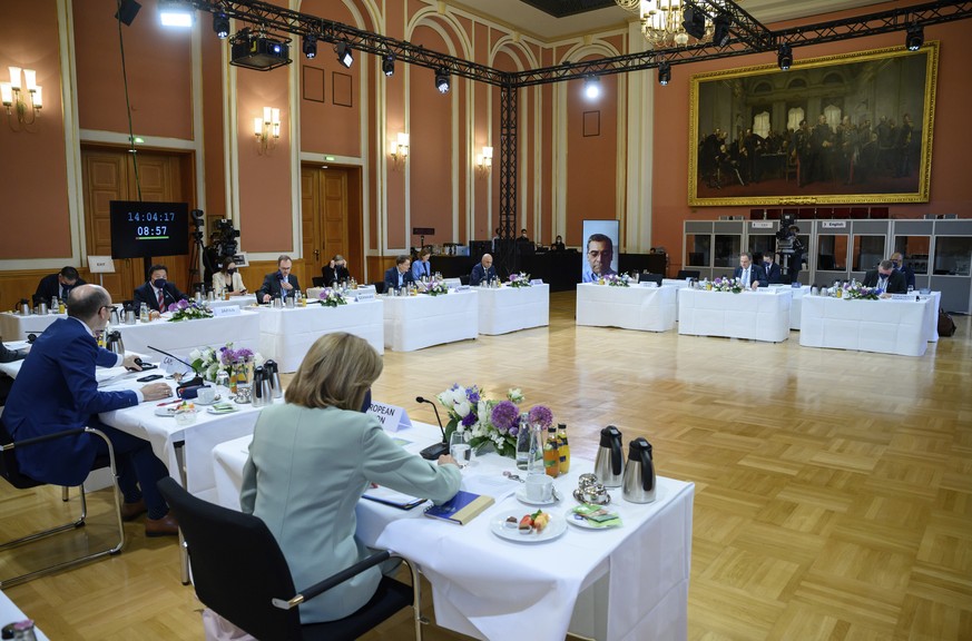 German Health Minister Karl Lauterbach, rear center, speaks as he opens a working session of a health ministers of the G7 countries in the Red City Hall in Berlin, Germany, Thursday, May 19, 2022. On  ...