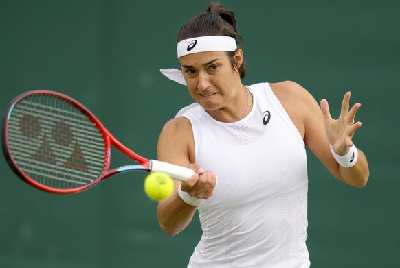 France&#039;s Caroline Garcia returns to China&#039;s Shuai Zhang during their women&#039;s singles third round match on day five of the Wimbledon tennis championships in London, Friday, July 1, 2022. ...