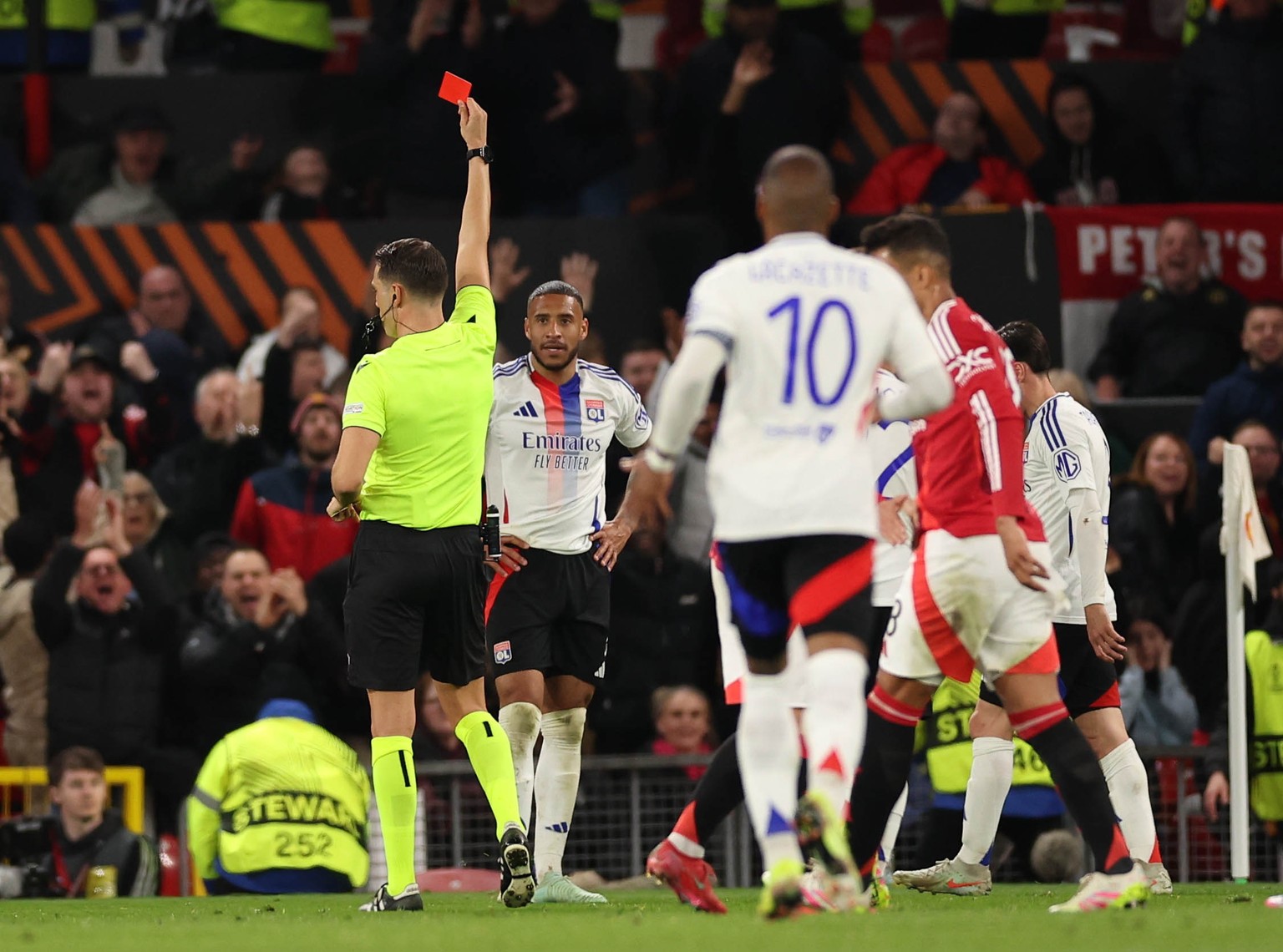 epa12037792 Corentin Tolisso of Lyon receives a red card during the UEFA Europa League quarter-finals 2nd leg soccer match between Manchester United and Olympique Lyonnais, in Manchester, Britain, 17  ...