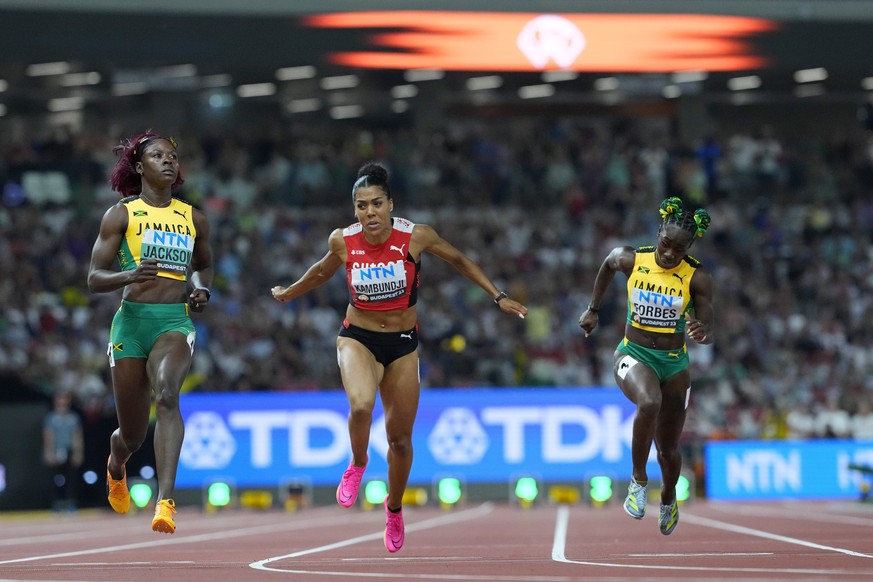Shericka Jackson, of Jamaica, Mujinga Kambundji, of Switzerland and Shashalee Forbes, of Jamaica race in a Women&#039;s 100-meters semifinal during the World Athletics Championships in Budapest, Hunga ...