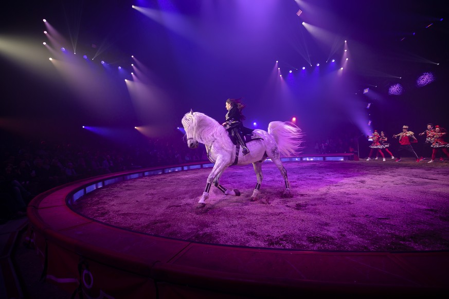 epa10514383 Chanel Marie Knie rides a horse during the season premiere of the 2023 tour of the Swiss Circus Knie, in Rapperswil, Switzerland, 10 March 2023. EPA/MICHAEL BUHOLZER