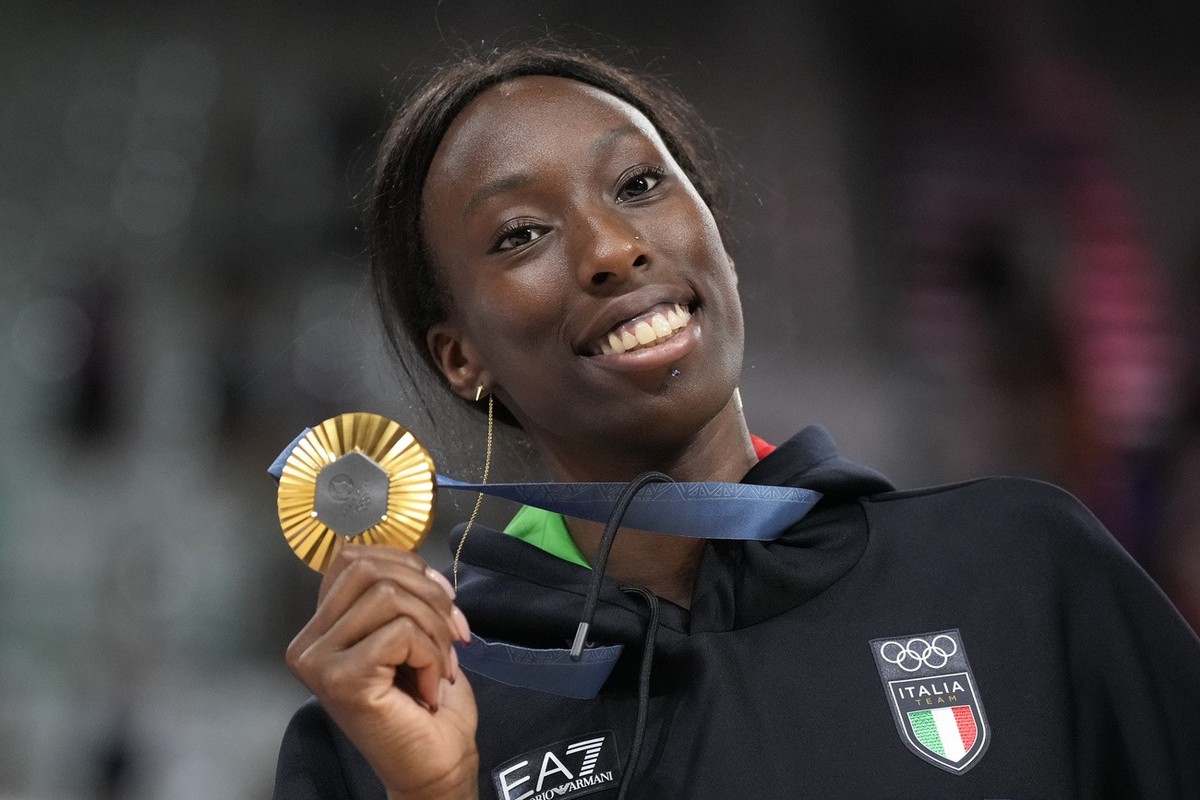 FILE - Paola Egonu of Italy shows her gold medal after the medal ceremony at the end of the women's volleyball final match against the United States of America at the 2024 Summer Olympics, Sunday ...