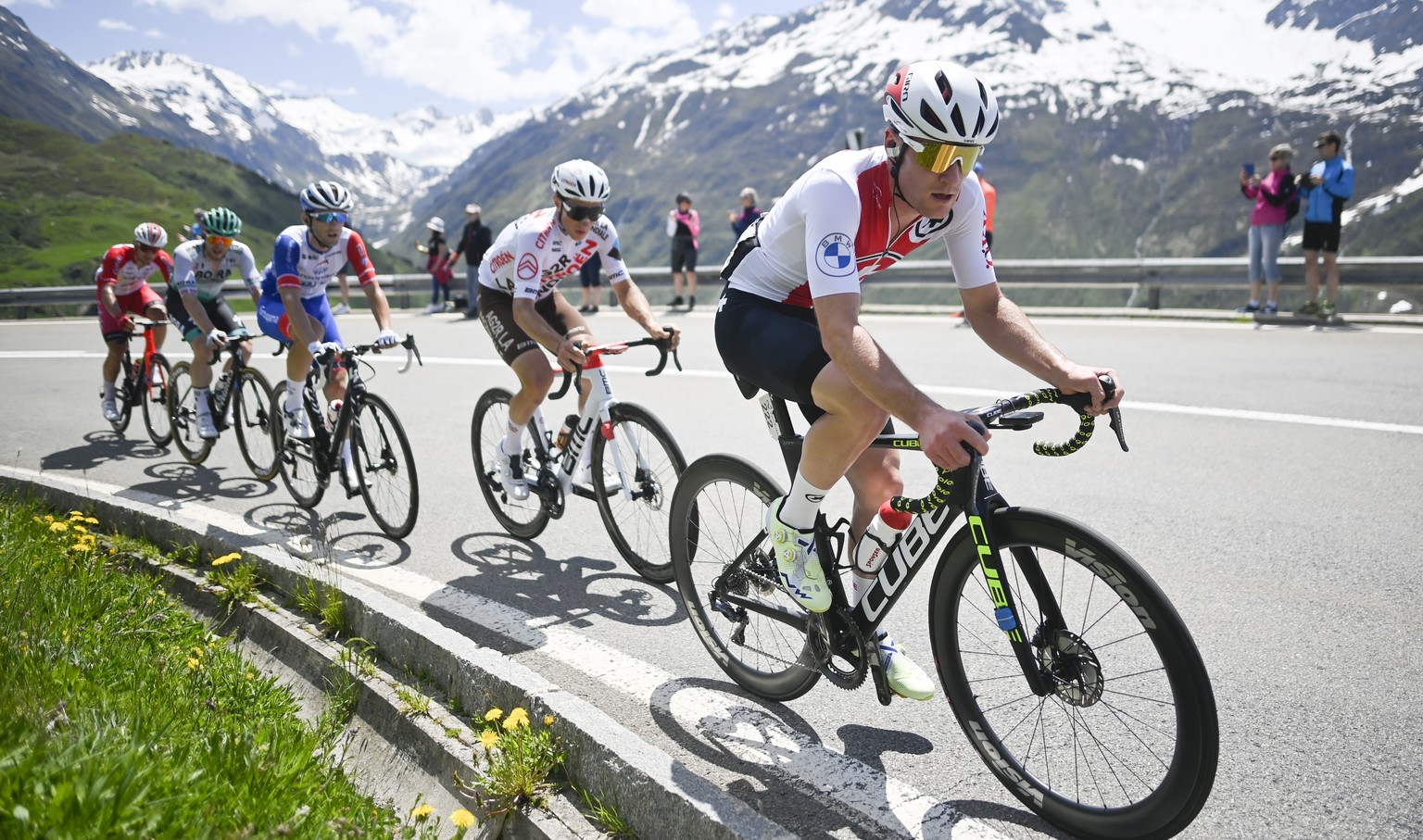Kevin Kuhn from Switzerland of Swiss Cycling, right, climbs towards Lukmanier pass during the eight and final stage, a 160 km race with start and finish in Andermatt, at the 84th Tour de Suisse UCI Pr ...