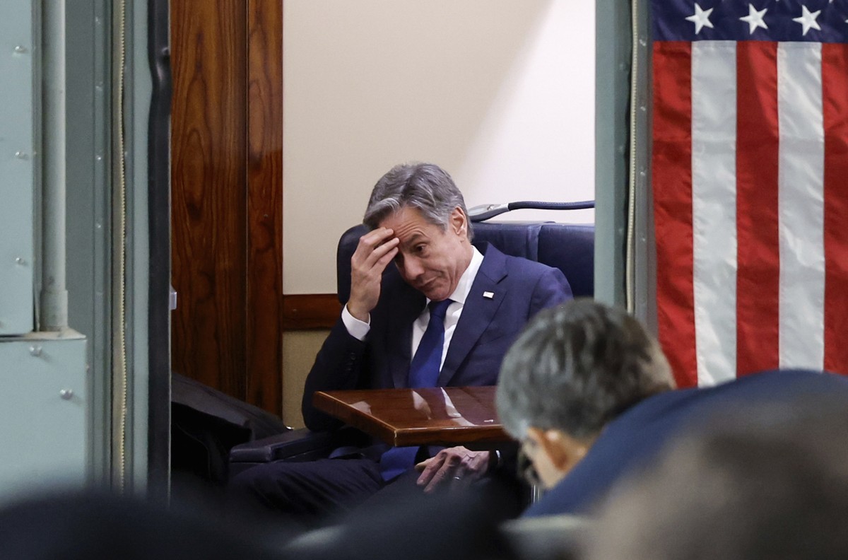 U.S. Secretary of State Antony Blinken sits onboard the plane during his visit to Israel as he departs en route to Jordan, Friday, Nov. 3, 2023. Blinken is in Israel to press for more humanitarian aid ...