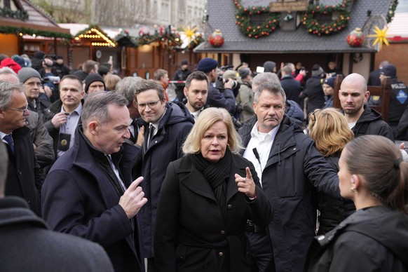 German Interior Minister Nancy Faeser gestures at a Christmas Market, where a car drove into a crowd on Friday evening, in Magdeburg, Germany, Saturday, Dec. 21, 2024. (AP Photo/Ebrahim Noorozi)