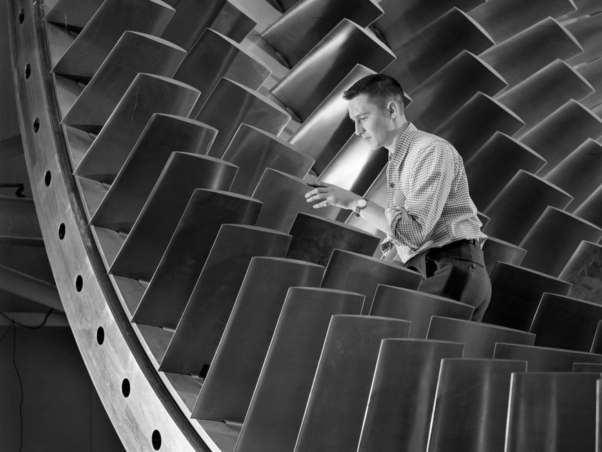 NACA Engineer Examines Wind Tunnel Compressor Blades
NASA ID: GRC-1955-C-39730
An engineer examines the main compressor for the 10- by 10-Foot Supersonic Wind Tunnel at the National Advisory Committee ...