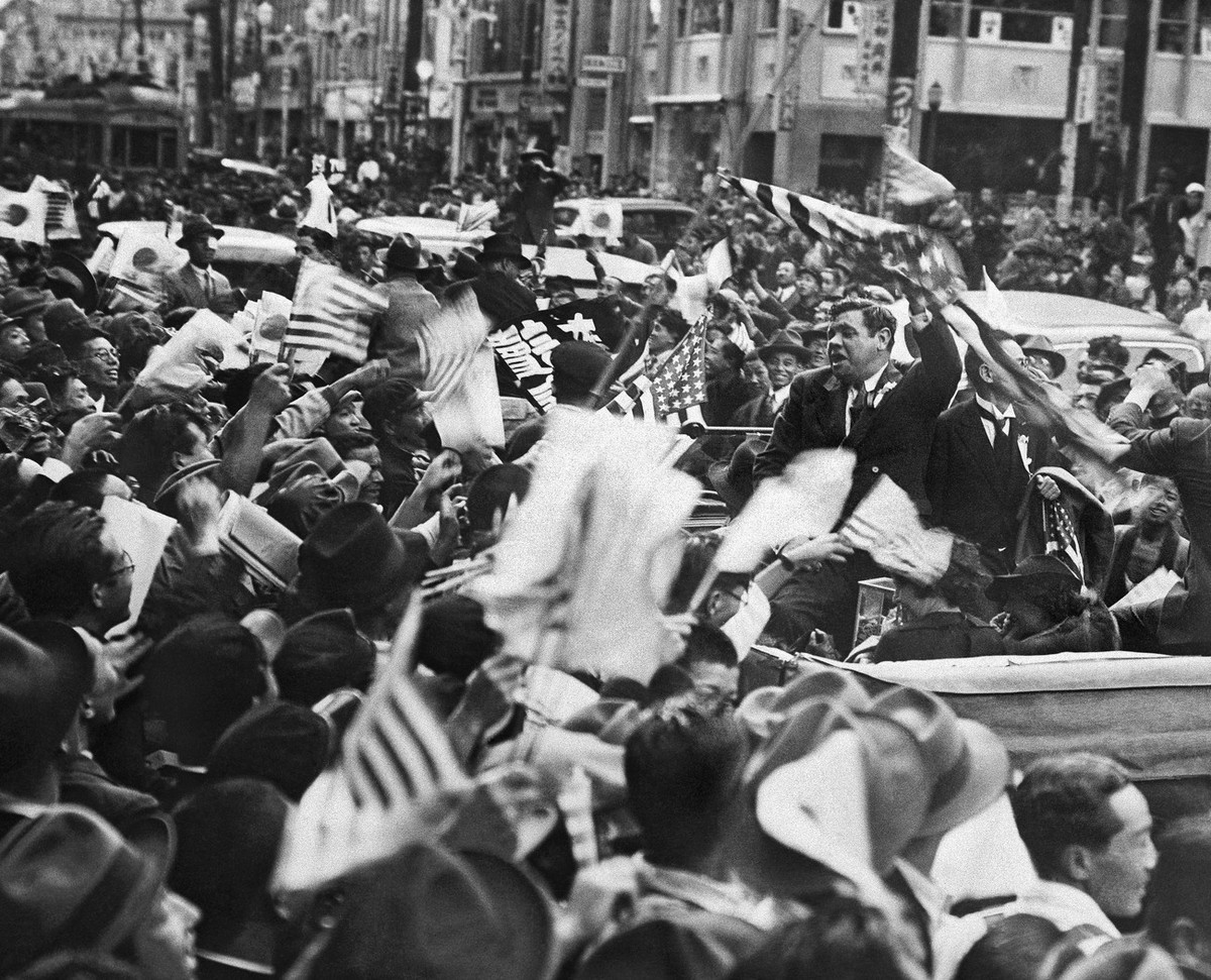 Babe Ruth receives a hero's welcome from fans in Tokyo, November 1934. Ruth, who had just finished the last of his fifteen seasons with the New York Yankees, was already well known in Japan, and ...