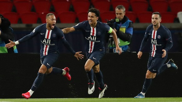 epa08287336 A handout photo made available by the UEFA shows (L-R) Neymar of Paris Saint-Germain celebrating with team mates Marquinhos and Pablo Sarabia after scoring the 1-0 goal during the UEFA Cha ...