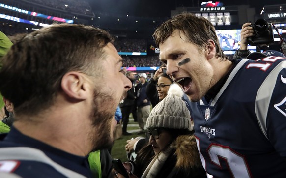 New England Patriots wide receiver Danny Amendola, left, and quarterback Tom Brady celebrate their victory over the Jacksonville Jaguars in the AFC championship NFL football game, Sunday, Jan. 21, 201 ...