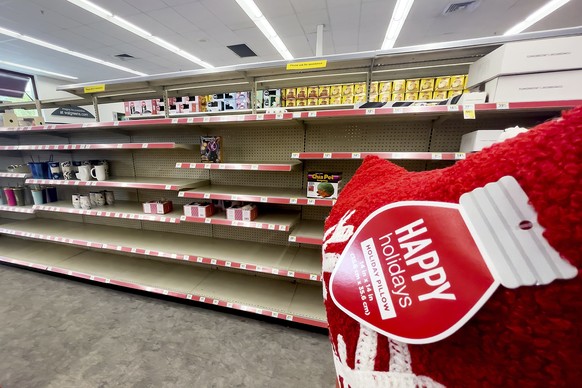 Sparsely stocked shelves line a Walgreens holiday gift section on Friday, Nov. 19, 2021, in Alameda, Calif. (AP Photo/Noah Berger)