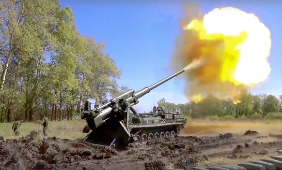 In this handout photo released by Russian Defense Ministry Press Service released on Sunday, June 5, 2022. A Pion artillery system of the Russian military fires at a target in an undisclosed location  ...