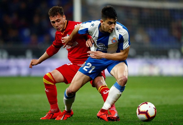 epa07480954 Getafe&#039;s Sebastian Cristoforo (L) in action against RCD Espanyol&#039;s Marc Roca (R) during the Spanish LaLiga soccer match between RCD Espanyol and Getafe at the RCDE Stadium in Cor ...