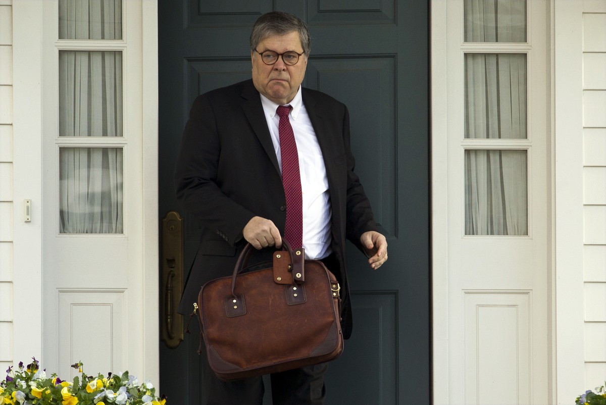 FILE - In this March 22, 2019, file photo, Attorney General William Barr leaves his home in McLean, Va. Barr told Congress on March 29, to expect version of special counsel's Russia report by mid ...