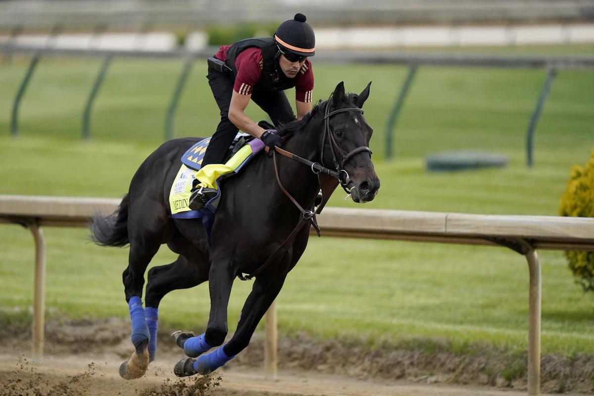 Kentucky Derby entrant Medina Spirit works out Churchill Downs Wednesday, April 28, 2021, in Louisville, Ky. The 147th running of the Kentucky Derby is scheduled for Saturday, May 1. (AP Photo/Charlie ...
