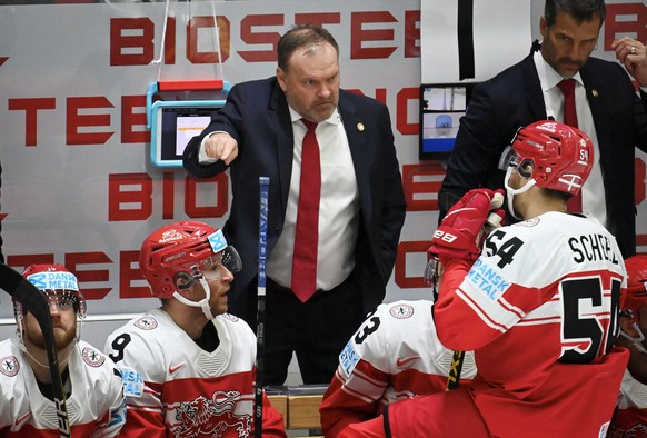 Team Denmark head coach Heinz Ehlers, centre, instructs players, during the 2022 IIHF Ice Hockey World Championships preliminary round group A match between Denmark and Kazakhstan in Helsinki, Saturda ...