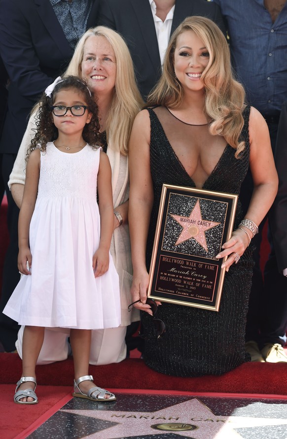 FILE - Mariah Carey appears with her mother Patricia and daughter Monroe during a ceremony honoring her with a star on the Hollywood Walk of Fame in Los Angeles on Aug. 5, 2015. (Photo by Chris Pizzel ...