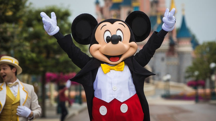 epa08547259 A performer wearing a Mickey Mouse costume celebrates on stage during the official ceremony of reopening of the Disneyland Paris theme park in Marne-la-Vallee, near Paris, France, 15 July  ...