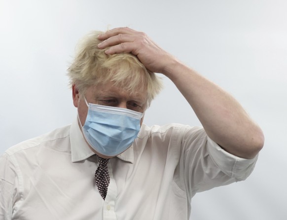 Britain&#039;s Prime Minister Boris Johnson gestures during a visit to Finchley Memorial Hospital, in North London, Tuesday, Jan. 18, 2022. (Ian Vogler, Pool Photo via AP)