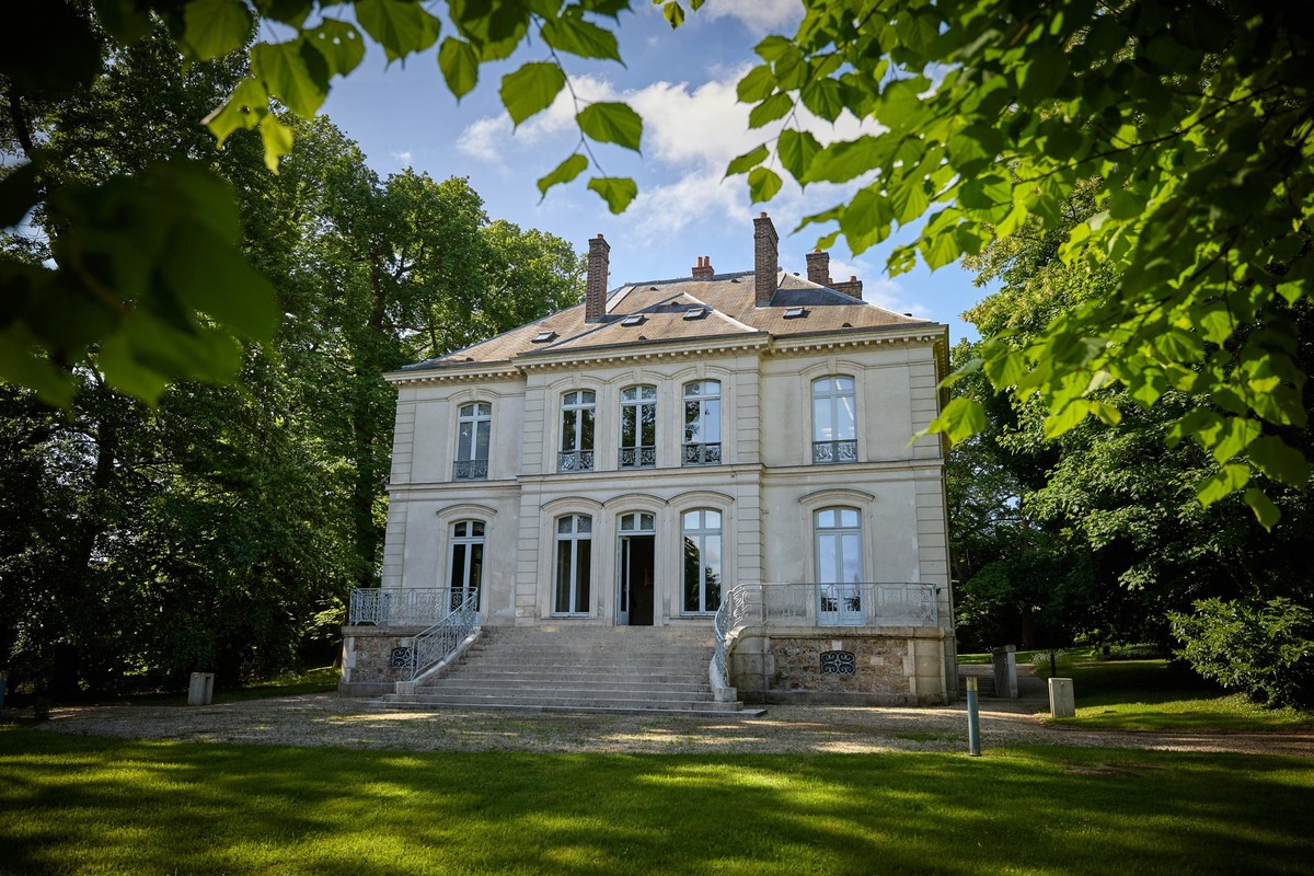 (FILES) This photograph shows the exterior of a house that belonged to the late German fashion designer Karl Lagerfeld, in Louveciennes, near Paris, on May 15, 2025. The historic 19th century house, a ...