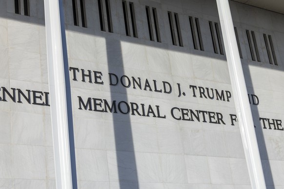 epa12605233 US President Donald J. Trump's name is seen above former President John F. Kennedy's on the John F. Kennedy Memorial Center for the Performing Arts building, in Washington, DC, U ...
