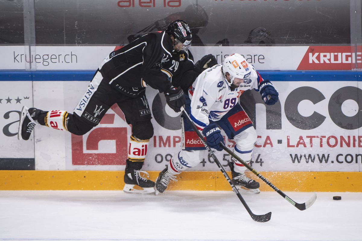 From left, Lugano?s player Jani Lajunen and Zurich's player Dominik Diem, during the preliminary round game of National League A (NLA) Swiss Championship 2019/20 between HC Lugano and ZSC Lions a ...