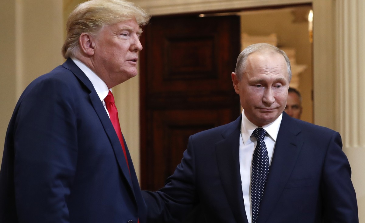 U.S. President Donald Trump, left, and Russian President Vladimir Putin leave a press conference after their meeting at the Presidential Palace in Helsinki, Finland, Monday, July 16, 2018. (AP Photo/P ...