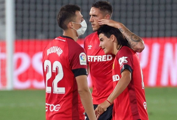 Mallorca s midfielder Luka Romero R, the youngest player of Spanish League history with fifteen years-old, at the end of the Spanish LaLiga soccer match between Real Madrid and RCD Mallorca played at  ...