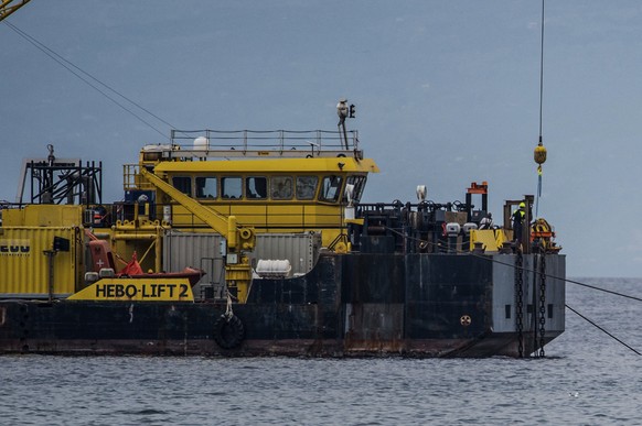 The multi-purpose floating work barge Hebo Lift 2 monitors the stretch of sea off Porticello, near Palermo, Sicily, Italy, Sunday, May 4, 2025, where the British superyacht Bayesian sunk on August 19, ...