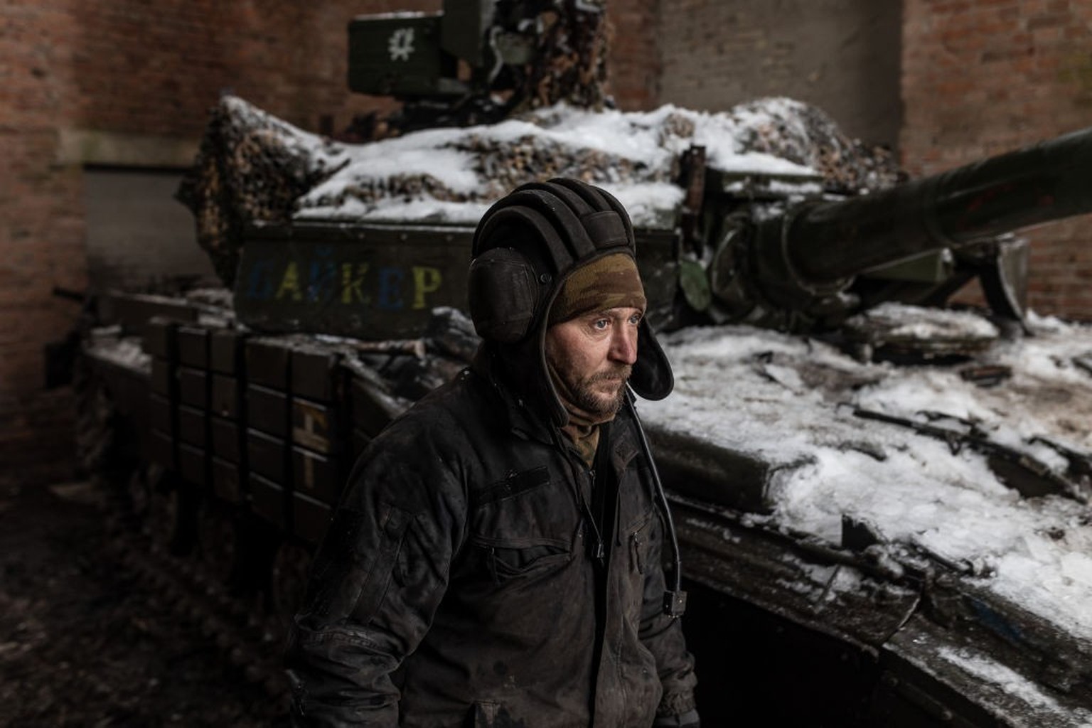 DONETSK OBLAST, UKRAINE - FEBRUARY 11: A Ukrainian soldier next to a tank in the direction of Bakhmut, where clashes between Russia and Ukraine continue to take place, in Donetsk Oblast, Ukraine on Fe ...