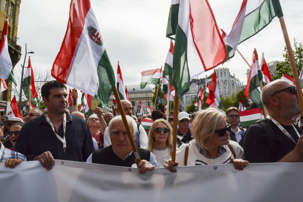 People gather in support of a political newcomer Peter Magyar, a former insider within Hungary's ruling Fidesz party on Saturday, April 6, 2024. A rising challenger to Hungarian Prime Minister Vi ...