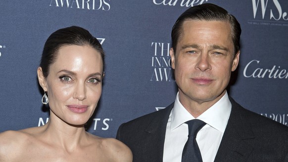 FILE - In this Nov. 4, 2015, file photo Angelina Jolie Pitt and Brad Pitt pose for a photo at the WSJ Magazine Innovator Awards 2015 at The Museum of Modern Art in New York. Jolie criticized a judge d ...