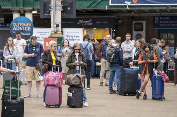 Passengers at Edinburgh&#039;s Waverley Station during nationwide rail strikes, in Edinburgh, Saturday, June 25, 2022. Train stations are all but deserted across Britain on the third day of a national ...