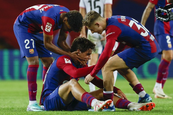 Barcelona&#039;s Lamine Yamal, left, Marc Guiu, center and Fermin Lopez Spanish celebrate at the end of the La Liga soccer match between Barcelona and Athletic Bilbao, at the Olympic Stadium of Montju ...